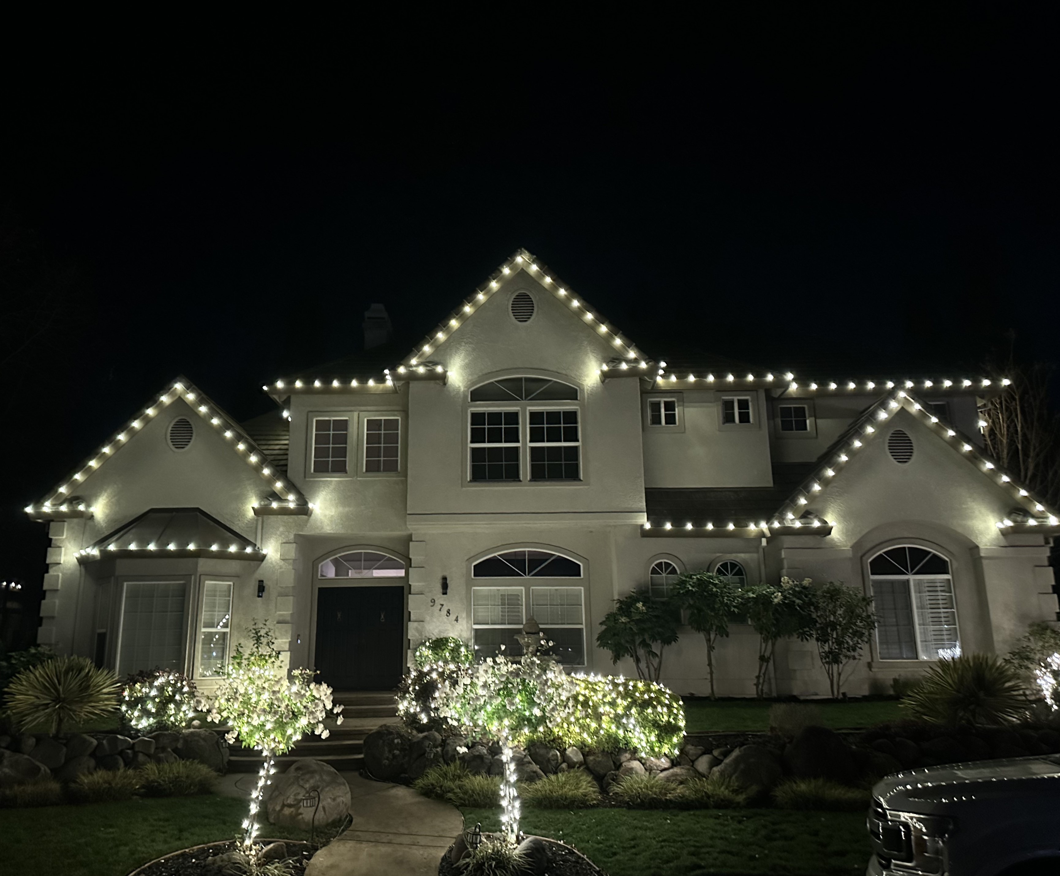 Roofline and yard Christmas lights for Rescue Christmas light installation by Glow Up Christmas Lights