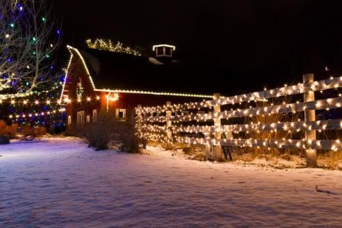 Roofline and yard holiday lighting, The Promontory Christmas light installation